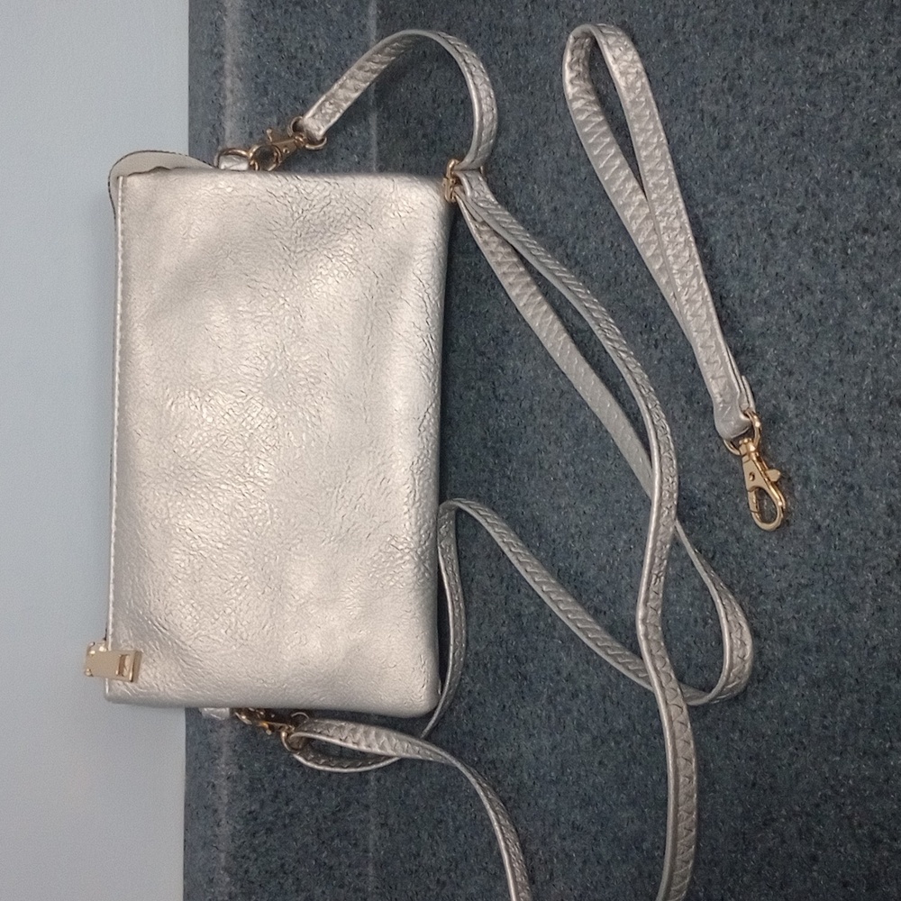 Silver crossbody/wristlet bag. NWT